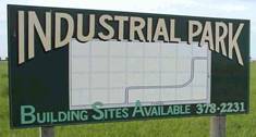 Industrial park building sites available 378-2231 sign